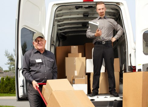 Man and a van team using safety equipment during a move in Hampstead