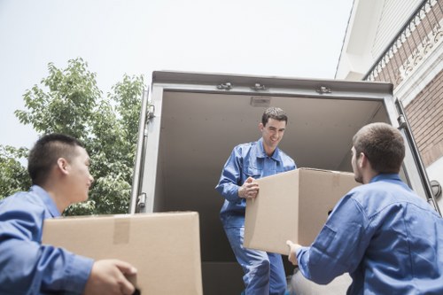Safe relocation process with staff reviewing equipment and work area