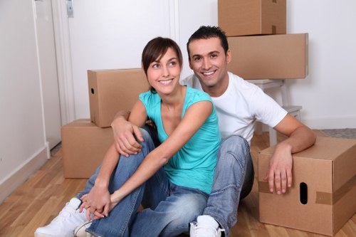 Careful moving of household items through a narrow Hampstead staircase