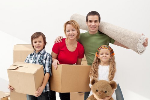 Professional movers protecting furniture during a Hampstead relocation