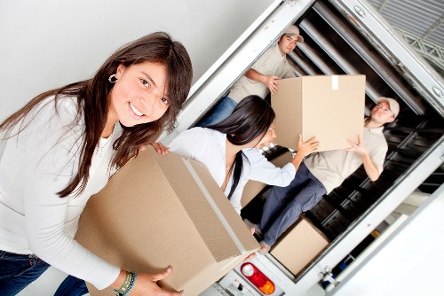 Packing and loading boxes into a removal truck in Hampstead